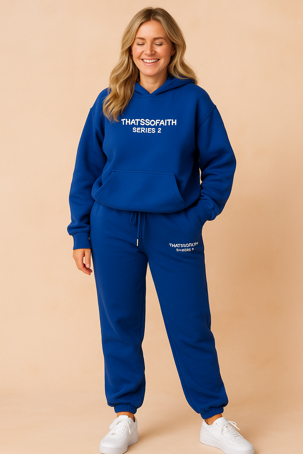 Bold royal blue hoodie and jogger pants co-ord set with white “THATSSOFAITH SERIES 2” prints, relaxed fit, elastic hems, and paired with classic white sneakers.