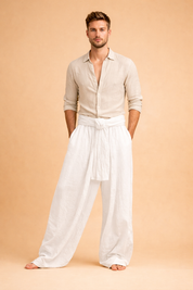 Loose-fit wrap trousers with wide legs and front tie waist paired with a clean short-sleeve crew-neck T-shirt, styled in a relaxed modern silhouette.