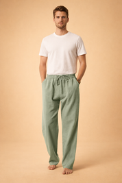 Relaxed-fit men’s trousers with a straight-leg silhouette, elastic waistband with adjustable drawstring, clean front panel, and fluid drape for a refined everyday look.