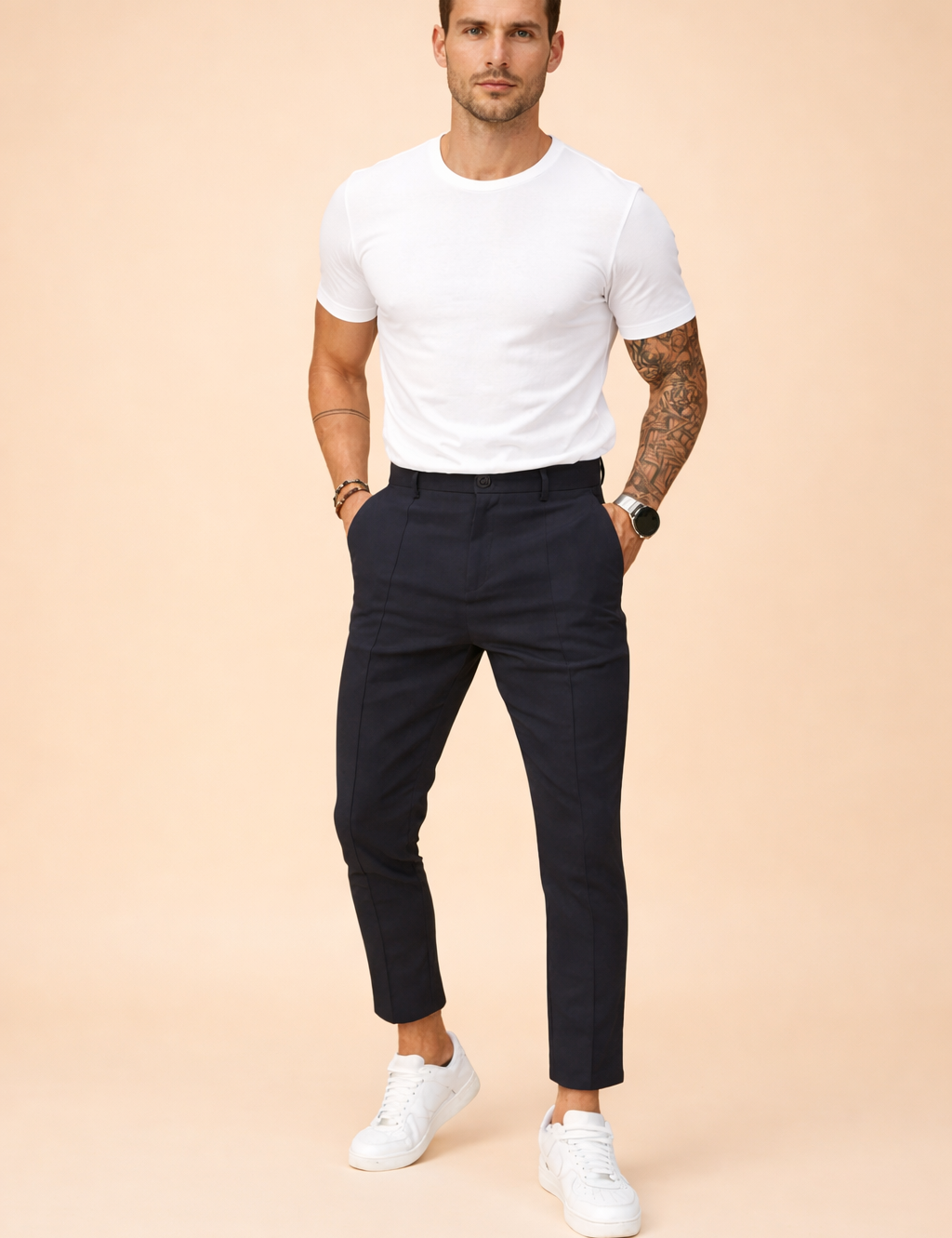 Tailored slim-fit ankle-length trousers styled with a clean short-sleeve top and minimalist low-profile sneakers, featuring a modern tapered leg and refined everyday silhouette.