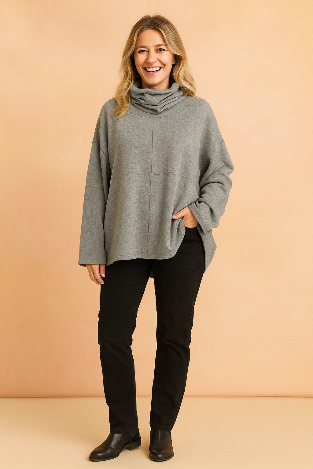 Oversized gray cowl neck sweatshirt with dropped shoulders and long sleeves, made from soft cotton-blend fabric with a relaxed fit and subtle center seam detail.