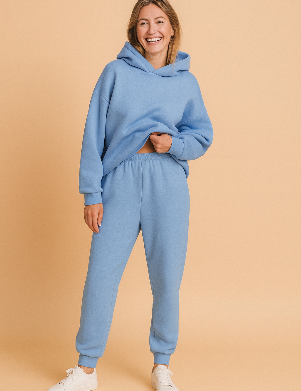 Oversized fleece hoodie in soft sky blue shade with matching elasticated jogger pants, styled for a cozy yet fashionable lounge look.