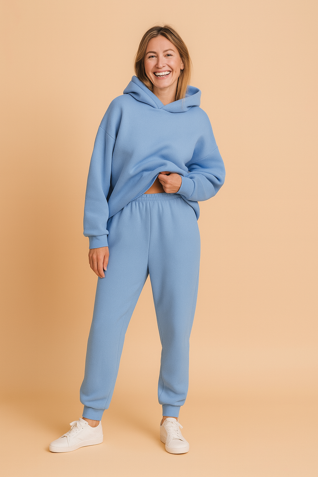 Oversized fleece hoodie in soft sky blue shade with matching elasticated jogger pants, styled for a cozy yet fashionable lounge look.