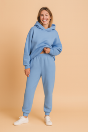 Oversized fleece hoodie in soft sky blue shade with matching elasticated jogger pants, styled for a cozy yet fashionable lounge look.