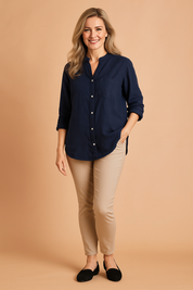 Navy blue mandarin collar long-sleeve button-down shirt with chest pocket and soft cotton-linen texture, worn untucked for a relaxed look.