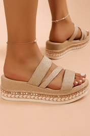 Gold glitter triple-strap platform sandals with woven espadrille detailing and textured midsoles, featuring metallic accents and a cushioned wedge sole.