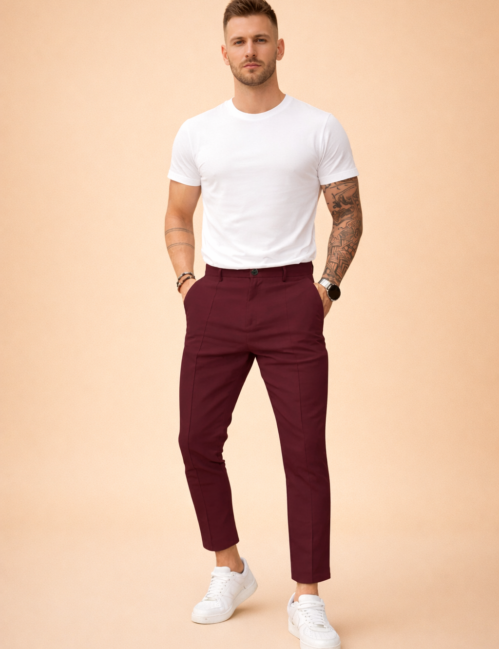 Slim-fit tailored trousers with clean front crease, mid-rise waist, belt loops, button closure, side pockets, tapered leg, ankle-length finish, styled with a tucked-in short-sleeve top and low-profile sneakers.