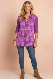 Women's casual outfit featuring a checkered button-up brown shirt with 3/4 sleeves, paired with high-waisted blue skinny jeans and white low-top sneakers.