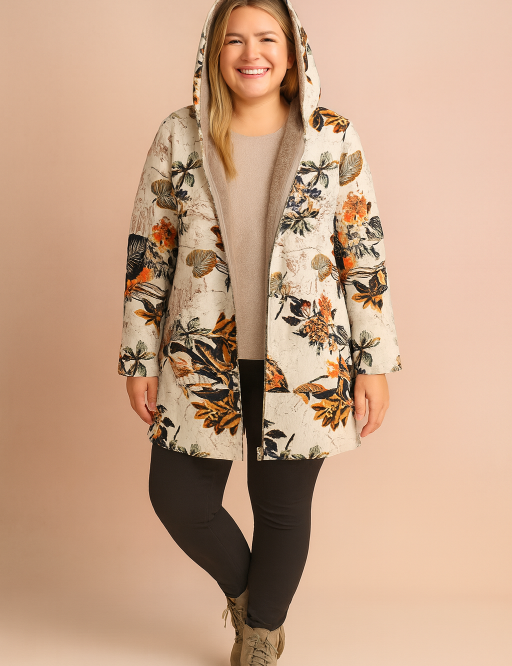 Floral hooded jacket with warm inner lining, paired with a beige sweater, slim black trousers, and taupe ankle boots.
