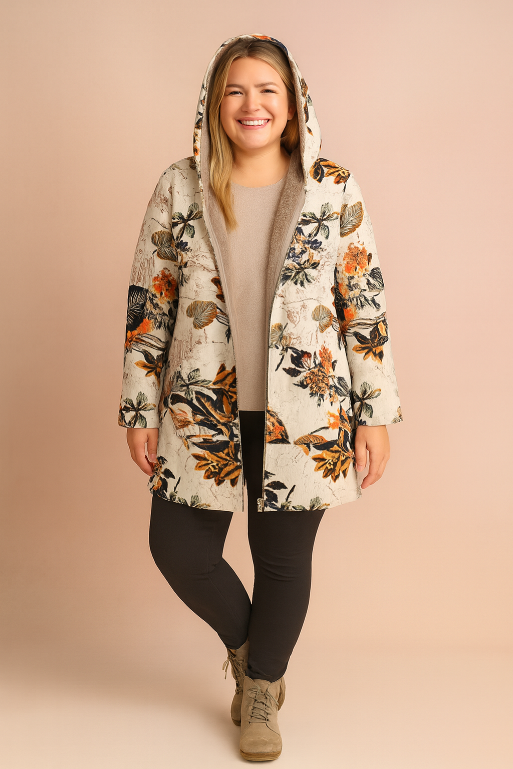 Floral hooded jacket with warm inner lining, paired with a beige sweater, slim black trousers, and taupe ankle boots.