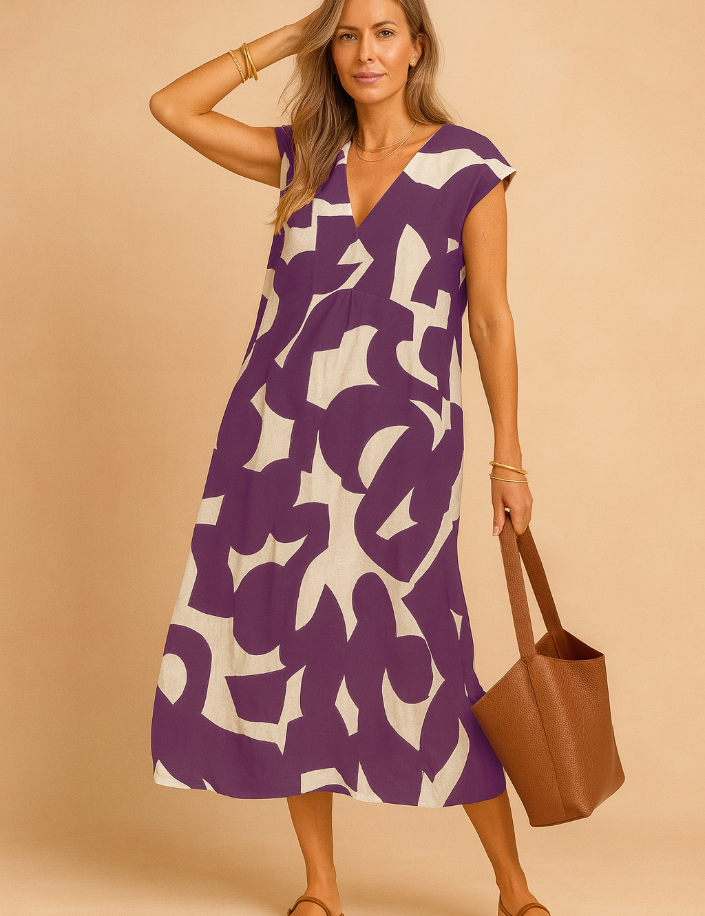 Chic European woman in a purple and beige graphic print midi dress with V-neckline.