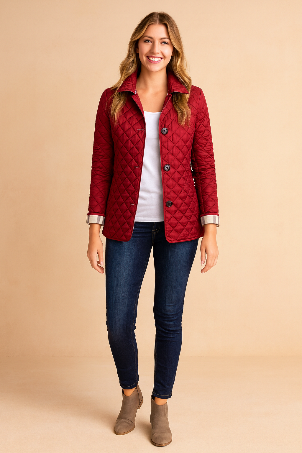 Red quilted button-down jacket with diamond pattern, styled over a white top, dark jeans, and ankle boots.