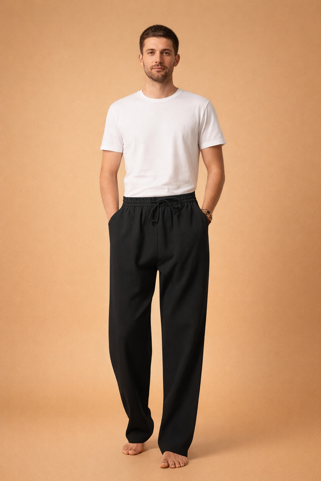 Light blue linen drawstring trousers with a relaxed straight-leg cut, elastic waistband with adjustable tie, soft textured fabric, and full-length drape paired with a clean white short-sleeve crew-neck T-shirt.