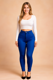 High-waisted royal blue skinny jeans paired with a fitted white crop top, showcasing a sleek, modern, and body-contouring design ideal for everyday wear.