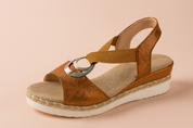 Women's platform sandal featuring a cognac faux snakeskin upper, beige woven insole, dual metallic silver rings on the vamp, and a thick white sole with jute-style rope trim.