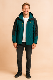 Teal and black outdoor softshell jacket with adjustable hood, full front zipper, zippered chest and side pockets, and durable water-resistant fabric paired with casual dark jeans and black sneakers.