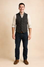 Dark Gray vintage button-up vest with a textured herringbone fabric, paired with a cream shirt and dark blue jeans, styled with a brown belt and leather shoes for a classic casual look.