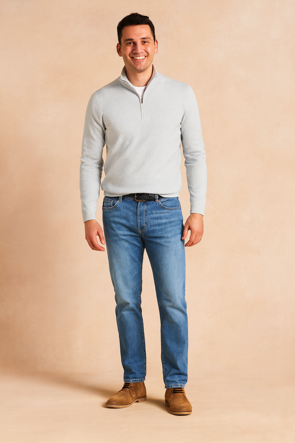 Men’s white half-zip pullover sweater with ribbed cuffs and hem, paired with straight-fit blue jeans and brown chukka boots, designed for a clean and versatile casual style