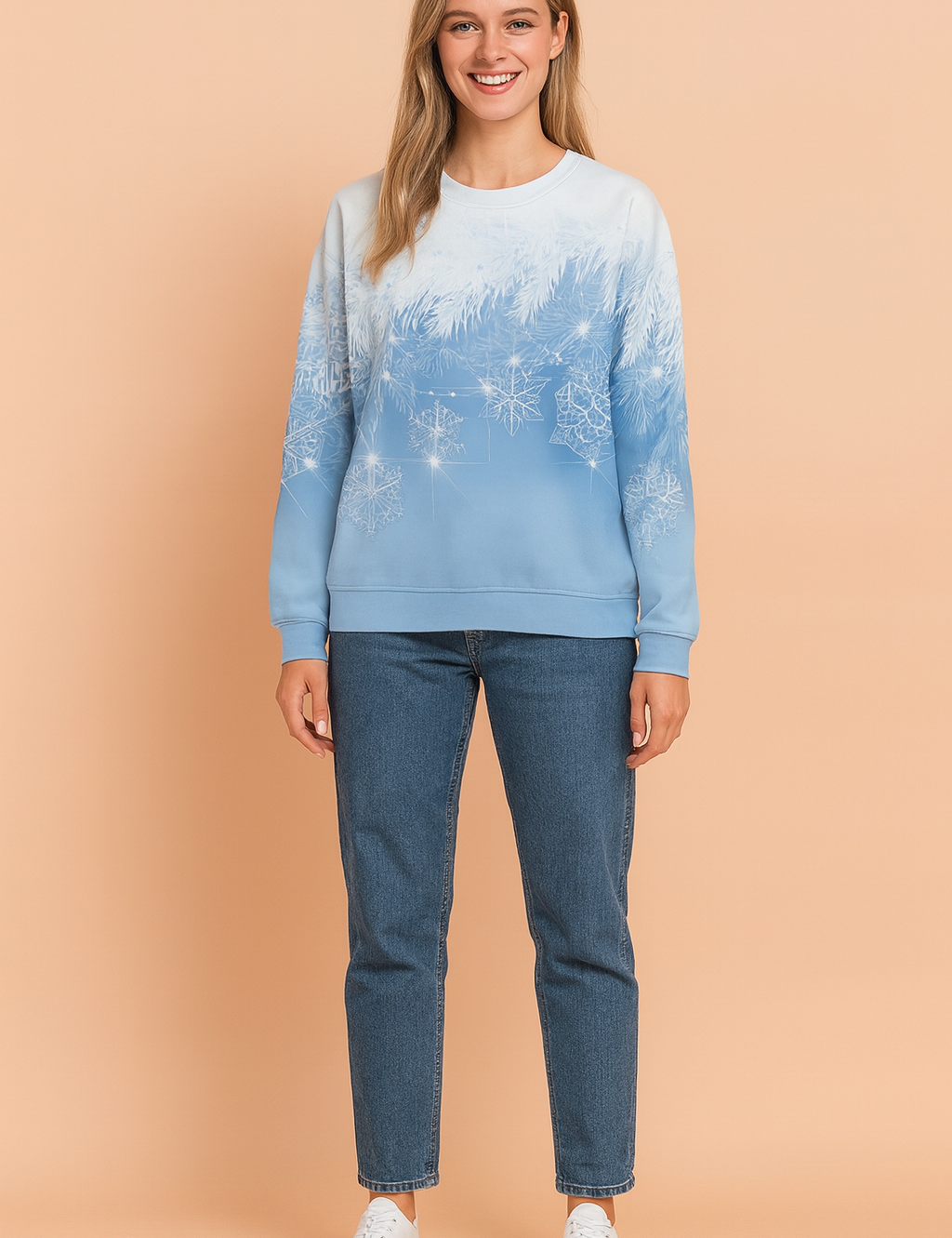 Light blue gradient sweatshirt with white frosted pine branch and snowflake print, paired with mid-wash straight-leg jeans and white lace-up sneakers.