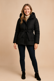 Women’s black short hooded puffer jacket with waist belt, front zipper, and quilted design, offering a warm and stylish winter outerwear option.