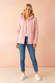 Women’s light pink hooded winter jacket with subtle embossed leaf print, front zipper closure, and side zip pockets, designed for comfort and seasonal warmth.