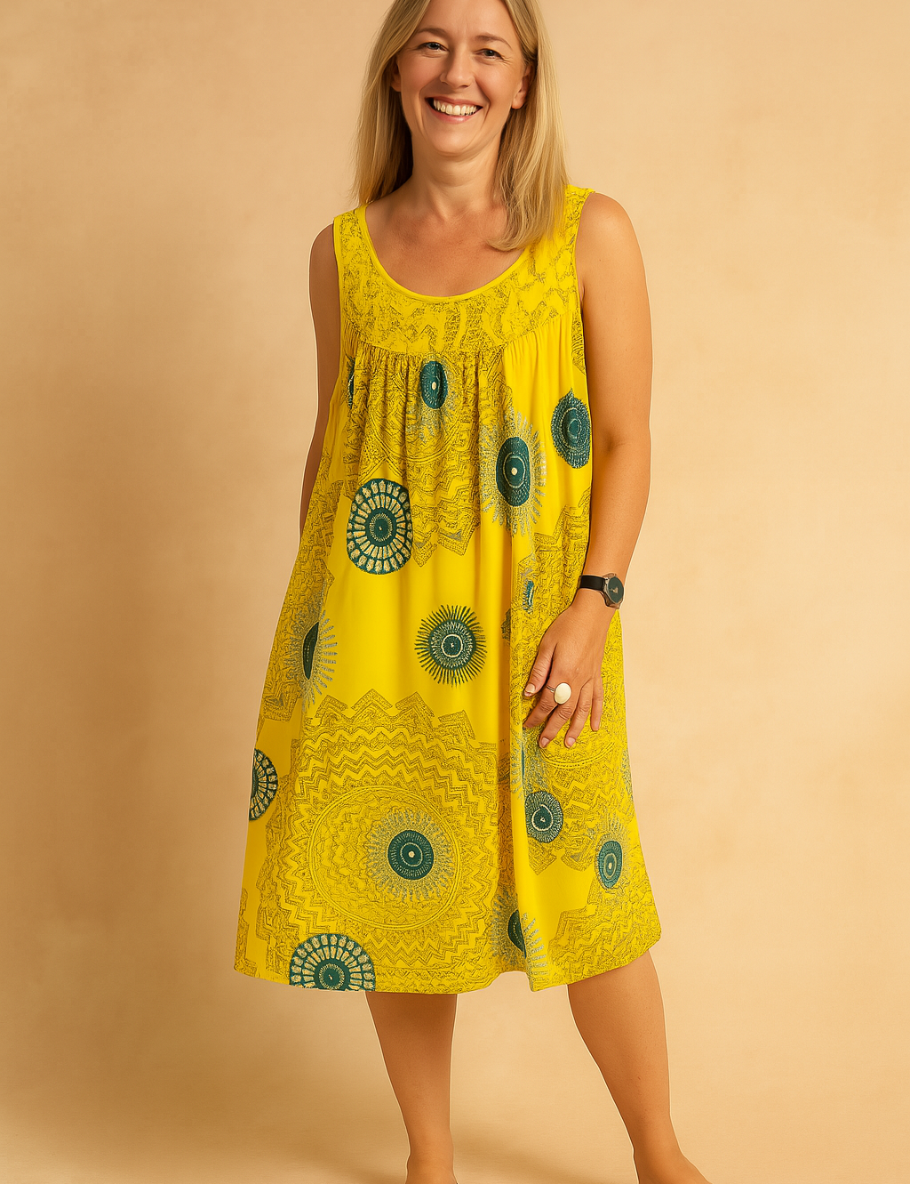 Sleeveless yellow swing dress with emerald green mandala print, featuring a gathered bust detail and relaxed A-line silhouette, perfect for casual summer styling.